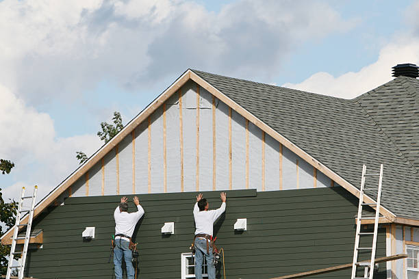 Professional Siding Contractor technician working in East Walpole, MA